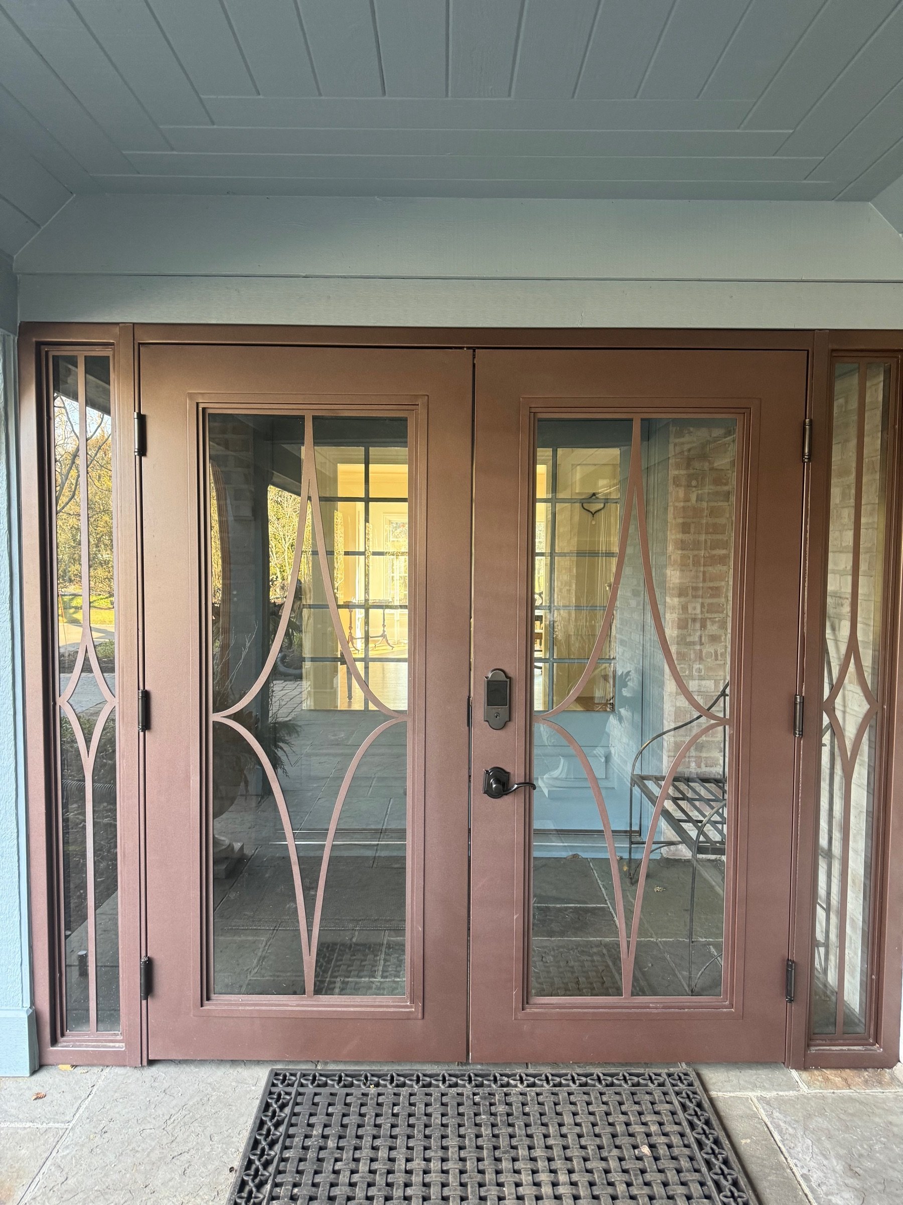Wide view of the arched wine cellar doors in the finished interior