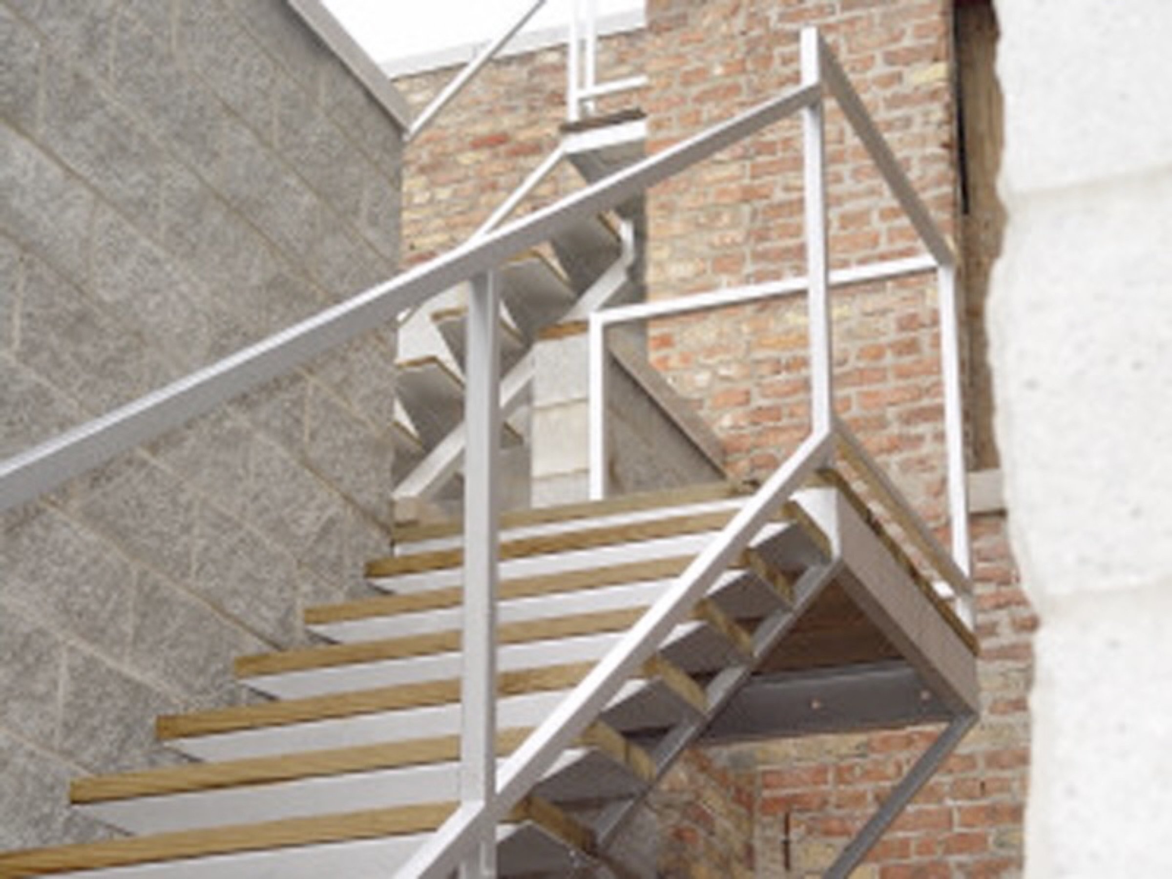 A straightforward steel stair railing with standard geometry