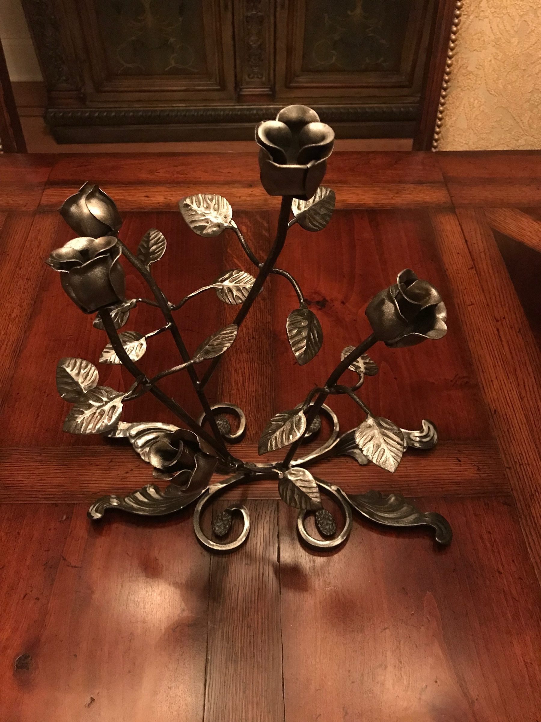 Hand-forged steel rose bouquet candelabra with five blooms and a scrollwork base
