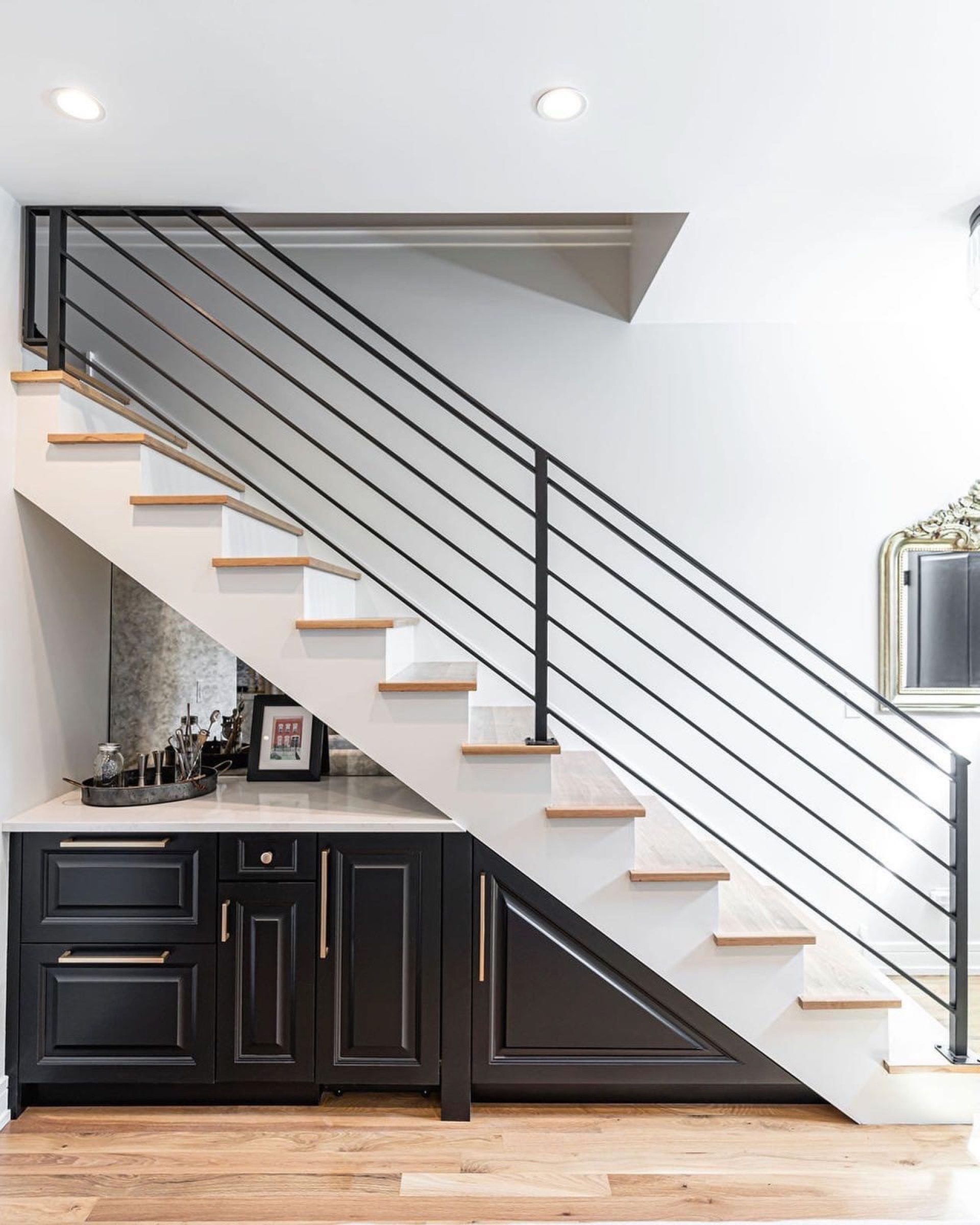 Horizontal-rod stair railing with a custom wet bar built into the space below