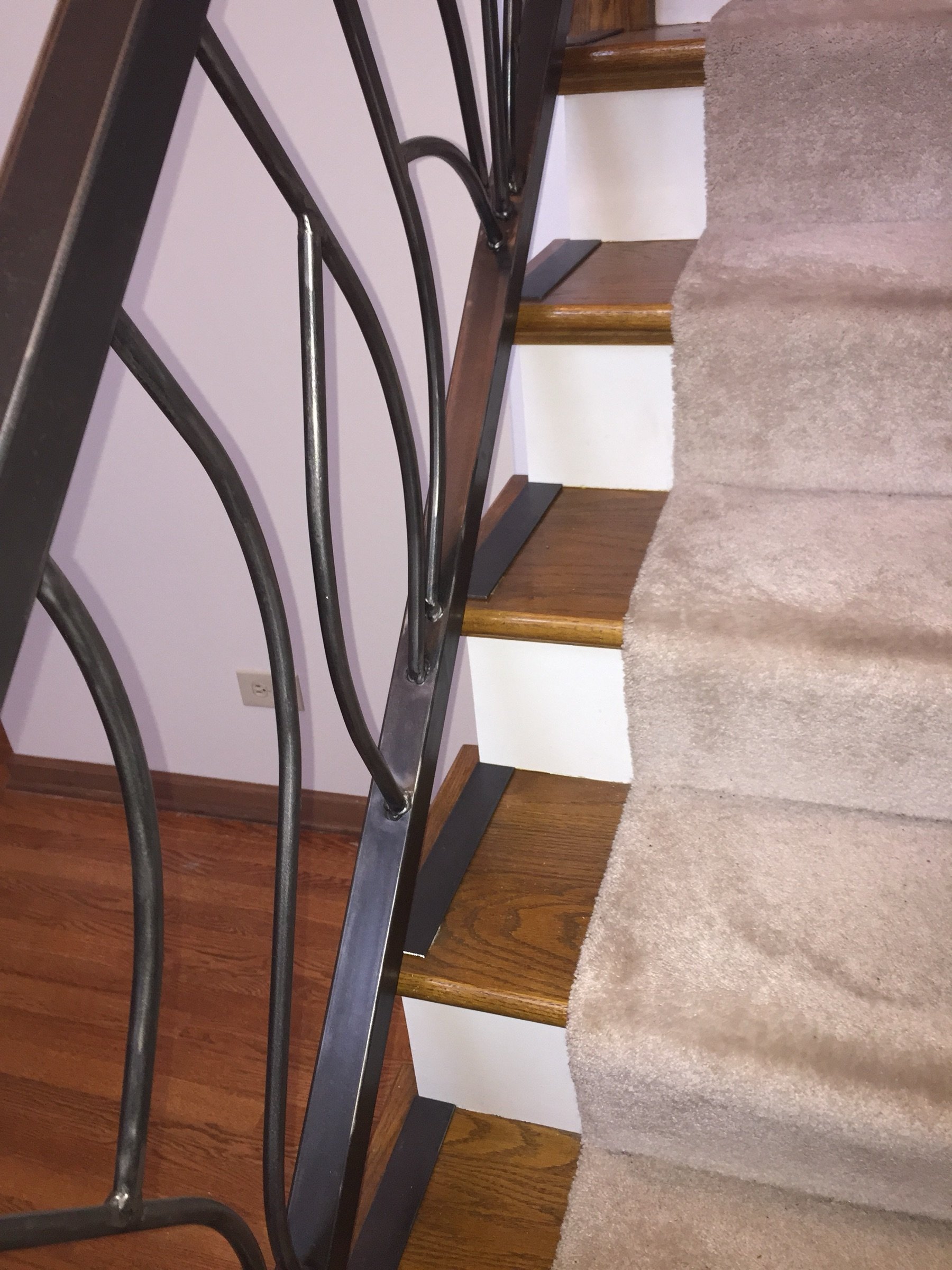 Close-up of a forged vine baluster with leaf and stem detail